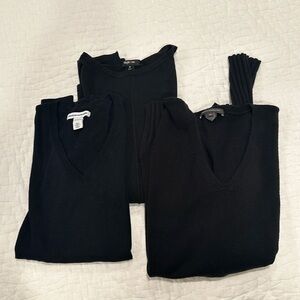 Three medium tall black sweaters.